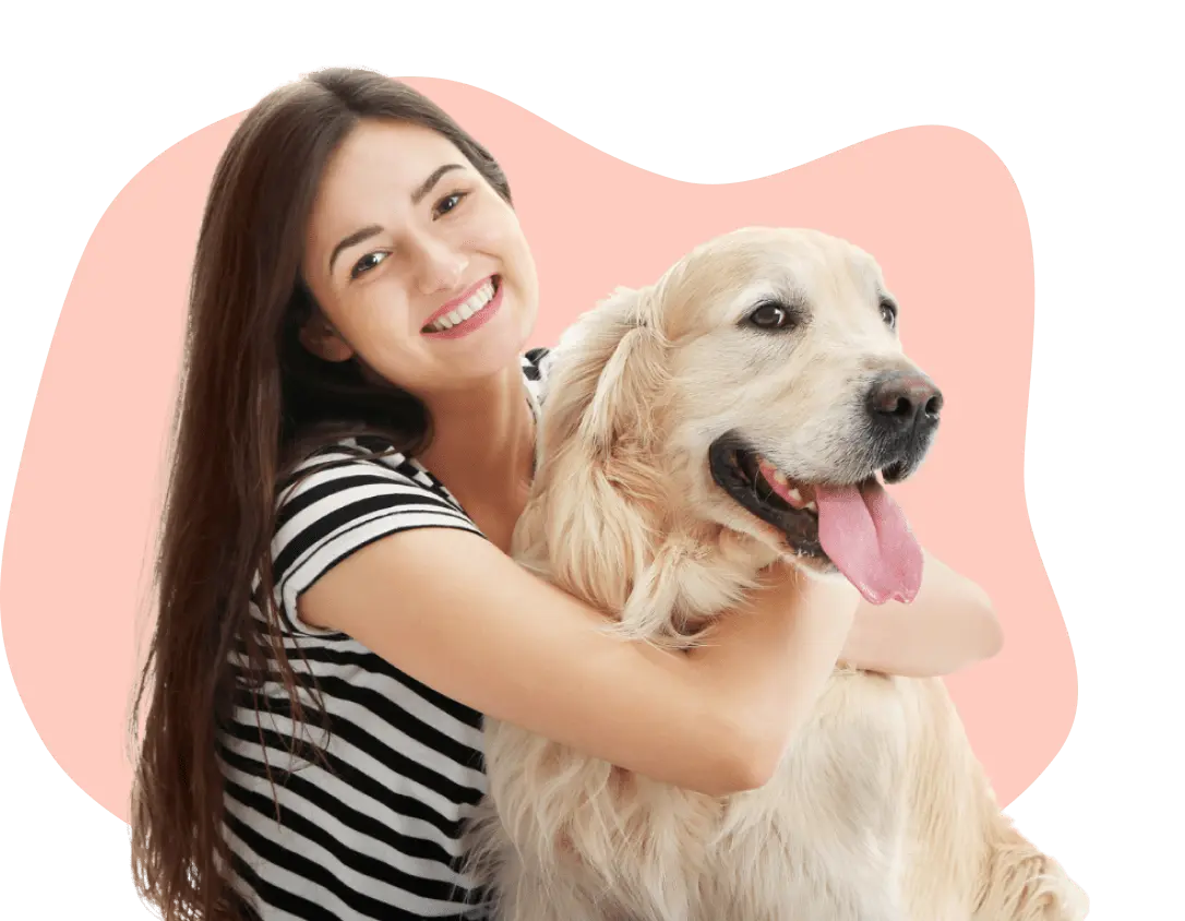 woman holding golden retreiver